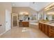 Bathroom featuring a glass-enclosed shower, soaking tub, and a double sink vanity at 3510 Estates Landing Nw Dr, Kennesaw, GA 30144