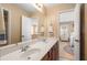 Bathroom featuring double sinks, a large mirror, and neutral walls at 3510 Estates Landing Nw Dr, Kennesaw, GA 30144