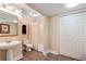 Neutral bathroom features a single sink, toilet, shower and large closet at 3510 Estates Landing Nw Dr, Kennesaw, GA 30144