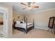 Bedroom has a large bed with carpet and an adjacent sitting area at 3510 Estates Landing Nw Dr, Kennesaw, GA 30144