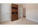 Bedroom featuring built-in wardrobe with access to multiple doorways at 3510 Estates Landing Nw Dr, Kennesaw, GA 30144