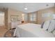 Bright bedroom featuring a double bed, a dresser and neutral walls at 3510 Estates Landing Nw Dr, Kennesaw, GA 30144