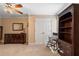 Bedroom with neutral walls, dresser, mirror, rocker and bookshelf at 3510 Estates Landing Nw Dr, Kennesaw, GA 30144