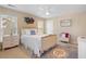 Bright bedroom featuring two windows and a white ceiling fan at 3510 Estates Landing Nw Dr, Kennesaw, GA 30144