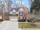 Beautiful two-story brick home with a manicured lawn and an expansive driveway to the 2 car garage at 3510 Estates Landing Nw Dr, Kennesaw, GA 30144