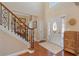 Bright foyer with hardwood floors, stairs, and a decorative front door with sidelights at 3510 Estates Landing Nw Dr, Kennesaw, GA 30144