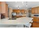 Kitchen island boasts seating and quartz countertops, complemented by stainless appliances at 3510 Estates Landing Nw Dr, Kennesaw, GA 30144