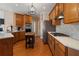 Kitchen featuring wood cabinets, stainless appliances, with butcher block island at 3510 Estates Landing Nw Dr, Kennesaw, GA 30144