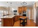 Spacious kitchen flows into living space with stainless appliances and butcher block island at 3510 Estates Landing Nw Dr, Kennesaw, GA 30144