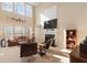 Bright living room featuring a fireplace, high ceilings, and modern decor at 3510 Estates Landing Nw Dr, Kennesaw, GA 30144