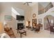 Inviting living room with a fireplace, and staircase to the second floor at 3510 Estates Landing Nw Dr, Kennesaw, GA 30144