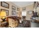 Elegant living room with leather sofa, bamboo chairs, and decorative wall art at 3510 Estates Landing Nw Dr, Kennesaw, GA 30144