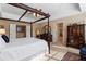 Spacious main bedroom featuring a tray ceiling, furniture, and elegant four-poster bed at 3510 Estates Landing Nw Dr, Kennesaw, GA 30144