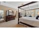 Spacious main bedroom featuring a tray ceiling, bay window, and elegant four-poster bed at 3510 Estates Landing Nw Dr, Kennesaw, GA 30144