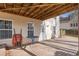 Covered patio featuring brick flooring, an outside door, and a small round table at 3510 Estates Landing Nw Dr, Kennesaw, GA 30144