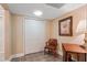 A simple sitting area features a closet, chair and accent table at 3510 Estates Landing Nw Dr, Kennesaw, GA 30144