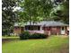 A fenced backyard offering a pink deck and beautiful green grass at 4188 Fontana Ct, Tucker, GA 30084