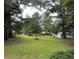 Lush backyard with mature trees offering plenty of shade and privacy at 4188 Fontana Ct, Tucker, GA 30084