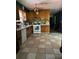 A spacious kitchen featuring tile flooring, wood cabinets, and white appliances at 4188 Fontana Ct, Tucker, GA 30084