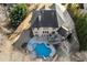 Aerial view of the private backyard featuring a uniquely shaped swimming pool and patio at 5245 Wilshire Xing, Cumming, GA 30040