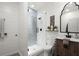 Modern bathroom showcasing a glass shower with patterned tile, shiplap walls, and a stylish vanity at 5245 Wilshire Xing, Cumming, GA 30040