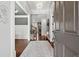 A stylish foyer with hardwood floors, classic wainscoting and elegant chandelier at 5245 Wilshire Xing, Cumming, GA 30040