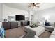 Comfortable living room with modern TV, built-in cabinets, and neutral tones at 5245 Wilshire Xing, Cumming, GA 30040