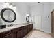 Elegant main bathroom featuring dual sinks, granite countertops, and modern fixtures at 5245 Wilshire Xing, Cumming, GA 30040