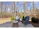 Outdoor patio with stamped concrete, fire pit, and Adirondack chairs perfect for backyard relaxation and entertaining at 5245 Wilshire Xing, Cumming, GA 30040