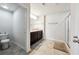Bathroom featuring double vanity, framed mirror, ceramic tile flooring, and glass-enclosed shower at 110 Centennial Ridge Dr, Acworth, GA 30102
