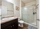 Bathroom featuring vanity, framed mirror, ceramic tile flooring, and glass-enclosed shower at 110 Centennial Ridge Dr, Acworth, GA 30102
