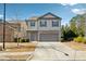 Beautiful two-story home with gray siding, a two-car garage, and a well-manicured front yard at 110 Centennial Ridge Dr, Acworth, GA 30102