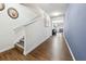 Open hallway featuring hardwood floors and access to the staircase at 110 Centennial Ridge Dr, Acworth, GA 30102