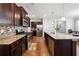 Beautiful kitchen with granite countertops, stainless steel appliances, and dark wood cabinets at 110 Centennial Ridge Dr, Acworth, GA 30102