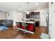 Open-concept kitchen with granite counters, stainless steel appliances and an island with bar stool seating at 110 Centennial Ridge Dr, Acworth, GA 30102