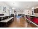 Spacious open-concept living area with hardwood floors, dining area, and bar seating at 110 Centennial Ridge Dr, Acworth, GA 30102