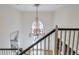 Bright foyer with hardwood floors, a decorative chandelier, and large windows at 2318 Edgemere Lake Cir, Marietta, GA 30062