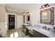 Bathroom with double vanity, stone floors, and a walk-in closet at 29 Macedonia Rd, White, GA 30184