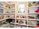 Walk-in pantry with abundant shelving provides ample storage for groceries and kitchen essentials at 29 Macedonia Rd, White, GA 30184