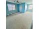 Blue primary bedroom featuring carpet flooring and natural light at 3254 Paul Harris Rd, Dallas, GA 30157