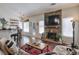 Comfortable living room featuring a stone fireplace, modern decor, and plenty of seating at 845 Johnson Mill Ter, Sugar Hill, GA 30518