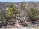 A scenic aerial shot of the home nestled among mature trees in a suburban neighborhood at 144 Murray Hill Ne Ave, Atlanta, GA 30317