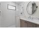 Modern bathroom with a walk-in shower, white subway tiles, and quartz countertops at 144 Murray Hill Ne Ave, Atlanta, GA 30317