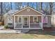 Inviting exterior of a single-story home with a quaint front porch at 144 Murray Hill Ne Ave, Atlanta, GA 30317