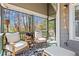 Relaxing screened porch featuring comfortable seating, string lights and a view of the serene backyard at 144 Murray Hill Ne Ave, Atlanta, GA 30317