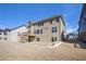 Rear exterior view of the house with a deck, patio, and expansive backyard at 2435 Portsmouth Ct, Marietta, GA 30064