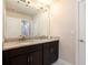 Bathroom featuring double sinks and a large mirror at 2435 Portsmouth Ct, Marietta, GA 30064