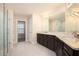 Luxurious bathroom featuring double vanities, granite countertops, tile flooring, and a glass-enclosed shower at 2435 Portsmouth Ct, Marietta, GA 30064