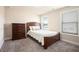 Bedroom showcasing a wooden bed frame and dresser at 2435 Portsmouth Ct, Marietta, GA 30064