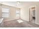 Bright bedroom with two windows and carpet flooring at 2435 Portsmouth Ct, Marietta, GA 30064